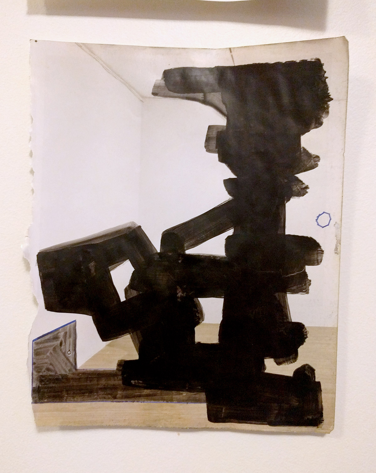 Blackout drawing - black acrylic on glossy art magazine page obscuring any images of art or people. 