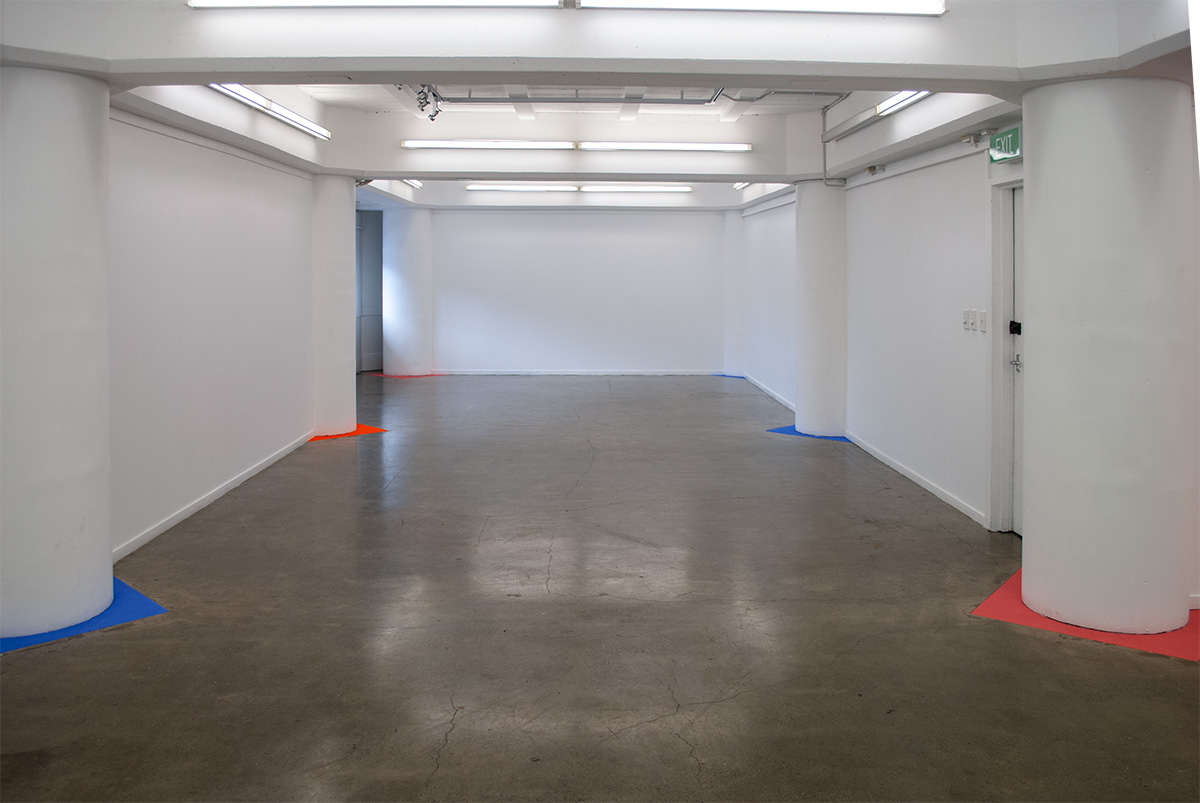 View into the end of toe of the L shaped gallery - powder paint triangles at six columns bases